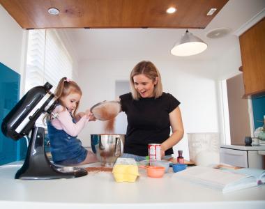lady with child cooking in kitchen