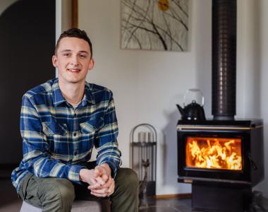 Man in front of fire